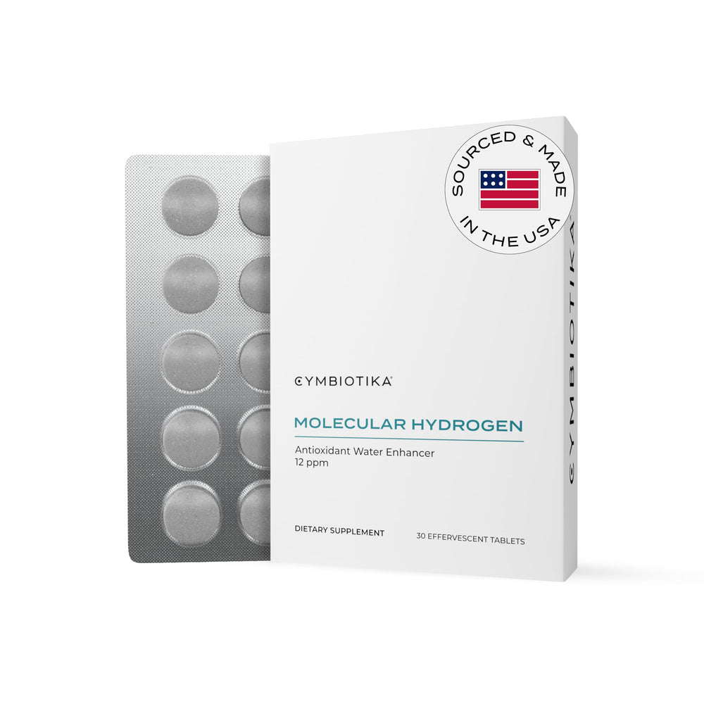 CYMBIOTIKA envase frontal mostrando tabletas y marca para uso portátil