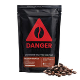 Danger Coffee frente del empaque mostrando sello y beneficio de pureza