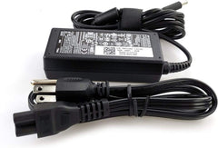 Dell charger label and specs closeup confirming 65W output and compatibility
