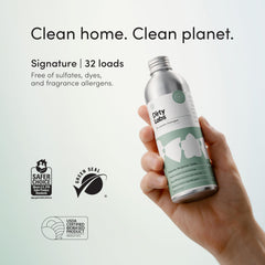 Dirty Labs botella siendo vertida en una lavadora, rendimiento para 32 lavados