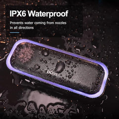 DOSS SoundBox Pro situada en la playa, resistente IPX6 para música al aire libre