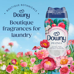 Downy tapa medidor con perlas en uso, facilita dosificación precisa