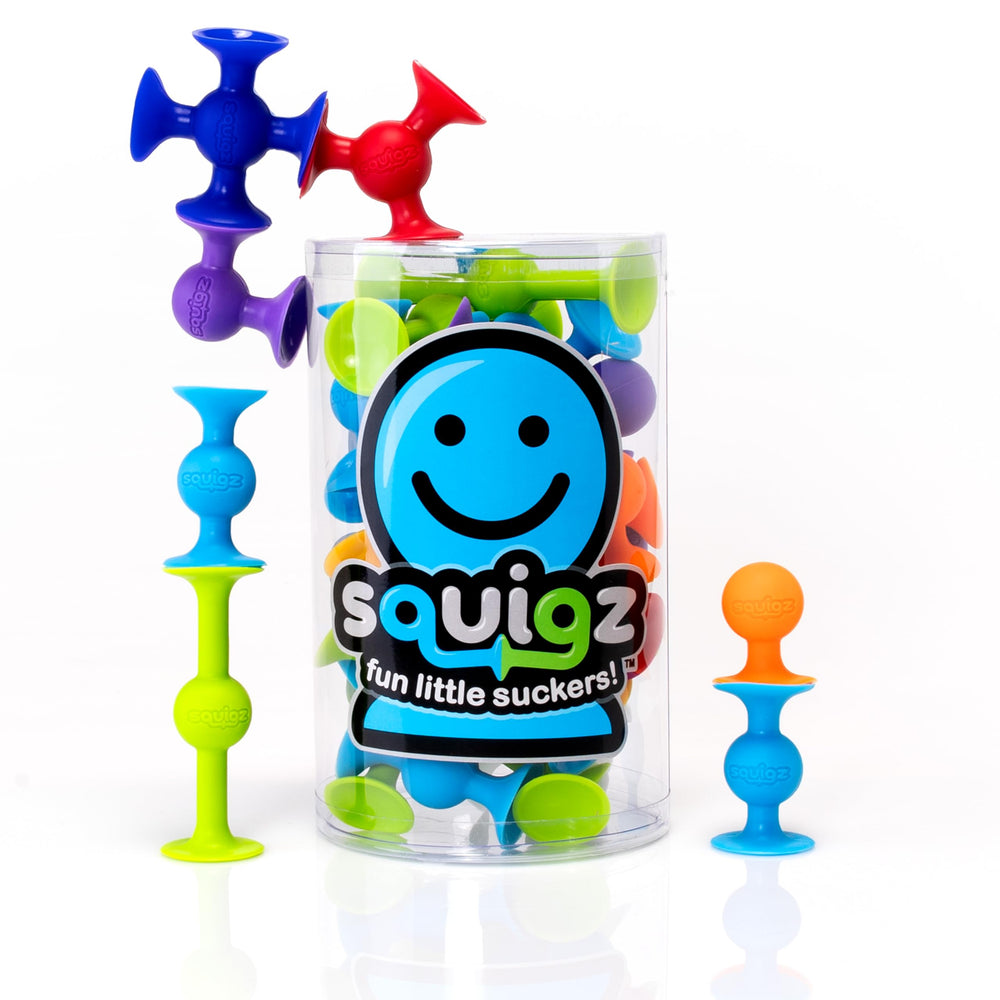 Fat Brain Toys Squigz frontal del empaque mostrando las 24 piezas y beneficio versátil