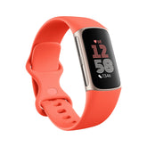 Fitbit Charge 6 frontal dorado coral mostrando la pantalla principal y diseño elegante