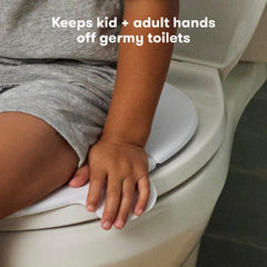 Frida Fold-and-Go en uso en baño público aportando confianza al niño