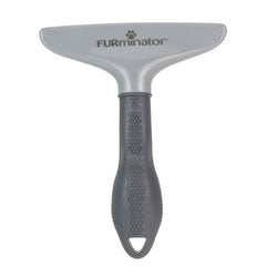 FURminator en uso cepillando gato para reducir pelo suelto
