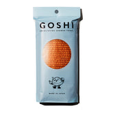 GOSHI toalla exfoliante frontal mostrando color naranja y forma larga, fácil agarre