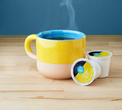 Capsula Happy Belly en primer plano destacando compatibilidad K-Cup