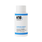 K18 envase frontal del champú mostrando diseño y beneficio protección del color