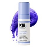 K18 envase frontal del champú TripleBright mostrando diseño y beneficio de brillo