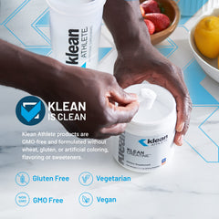 Klean Athlete bote abierto con cucharilla listo para dosificar beneficio práctico