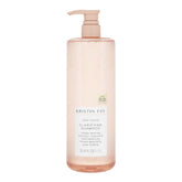 Kristin Ess frente del envase mostrando etiqueta y volumen, confianza en limpieza