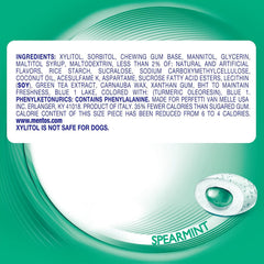 Person grabbing Mentos gum from a bag demonstrating convenient on-the-go freshness