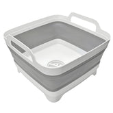 MontNorth vista frontal del lavabo plegable mostrando su forma y color gris y beneficio de portabilidad