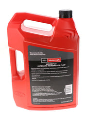 Vierte de fluido Motorcraft XT105Q3LV mostrando textura y color, facilita identificación y manejo seguro
