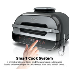 Ninja Foodi Smart XL cocinando pechugas y verduras, función air crisp visible