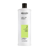 NIOXIN envase frontal mostrando diseño profesional y limpieza profunda