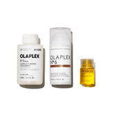 OLAPLEX frente del embalaje del set mostrando los tres productos y ventaja exclusiva