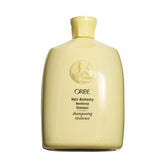Oribe Hair Alchemy frontal mostrando botella elegante y beneficio fortalecedor