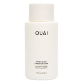 OUAI botella frontal del acondicionador mostrando tamaño y diseño elegante