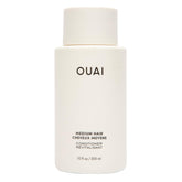 OUAI botella frontal mostrando diseño y tamaño para identificar el acondicionador