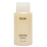 OUAI envase frontal 10 oz mostrando diseño y tamaño práctico