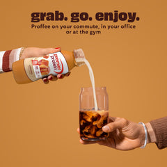 Premier Protein caramel held in hand to show bottle size and portability