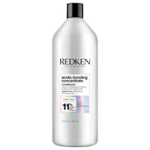 Redken botella frontal Acidic Bonding Concentrate mostrando el formato y la marca, ideal para reparación