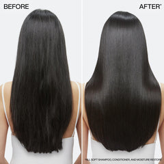 Redken All Soft botella 16.9 fl oz comparada con una mano para escala