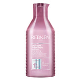 Redken champú frente del envase mostrando diseño profesional y volumen