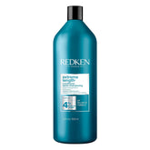 Redken envase frontal 33.8 fl oz mostrando diseño y tamaño práctico