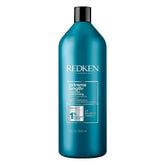 Redken envase frontal mostrando diseño y tamaño 33.8 oz, aporte profesional