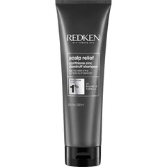 Redken envase frontal del champú anticaspa mostrando diseño profesional y limpieza