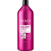 Redken frasco frontal 33.8 oz mostrando marca y envase protector