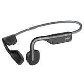 SHOKZ OpenMove frontal gris mostrando diseño open-ear y comodidad