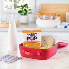 detailed view of a SkinnyPop White Cheddar bag label showing dairy-free seasoning benefit