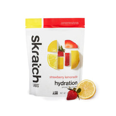 Hand holding scoop of Skratch Labs powder, single‑serve portion control benefit