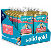 Solid Gold envase frontal del topper de caldo de salmón, muestra practicidad
