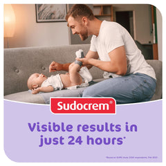 Sudocrem tamaño 14oz comparado con mano para escala y duración
