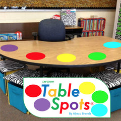 Table Spots frontal del empaque mostrando 10 círculos coloridos y beneficios