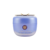 TATCHA frasco frontal mostrando diseño y efecto hidratación visible