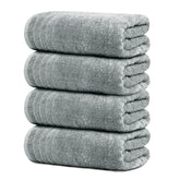Tens Towels vista frontal del paquete mostrando las cuatro toallas y tono gris frío, ideal para decoración