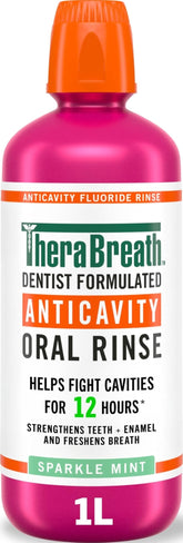 TheraBreath botella frontal 1 litro mostrando etiqueta y tamaño para uso familiar