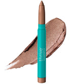 Thrive Causemetics empaque frontal del stick mostrando tono Pili y beneficio iluminador