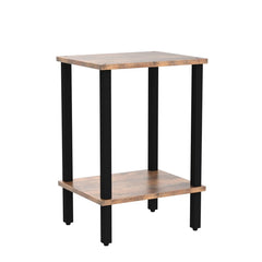 TUTOTAK mesa en uso junto al sofá con lámpara y vaso