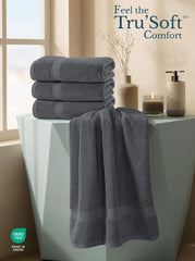 Utopia Towels comparación de tamaño con una regla, mostrando dimensiones 27x54 pulgadas prácticas
