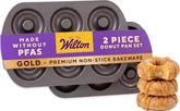 Wilton front view of the gold donut pan showing nonstick finish and compact size benefit