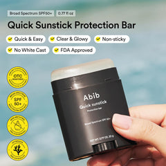 Abib sunsticks held in hand to show compact scale and portability benefit