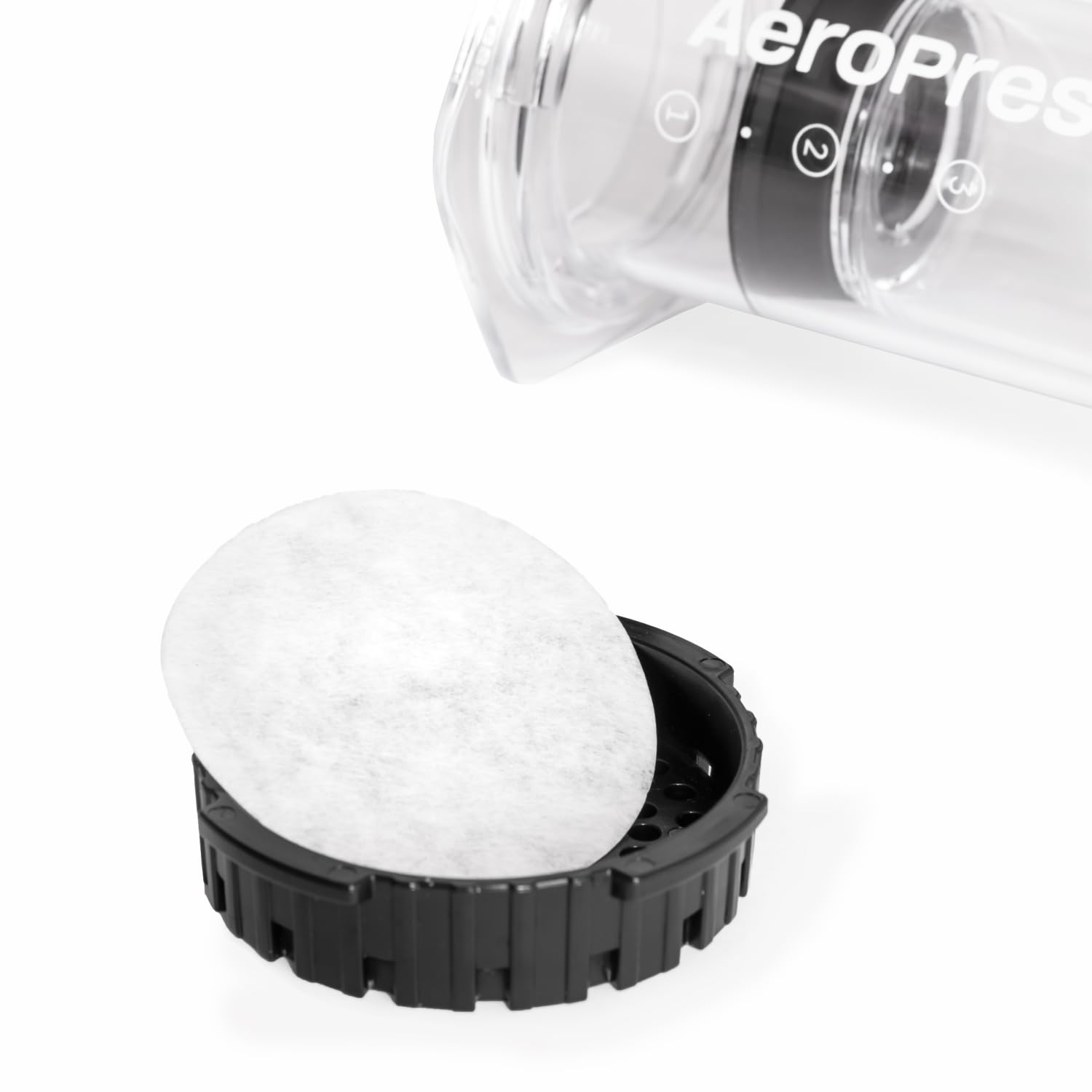AeroPress filtros apilados resaltando textura ultrafina y eliminación de posos
