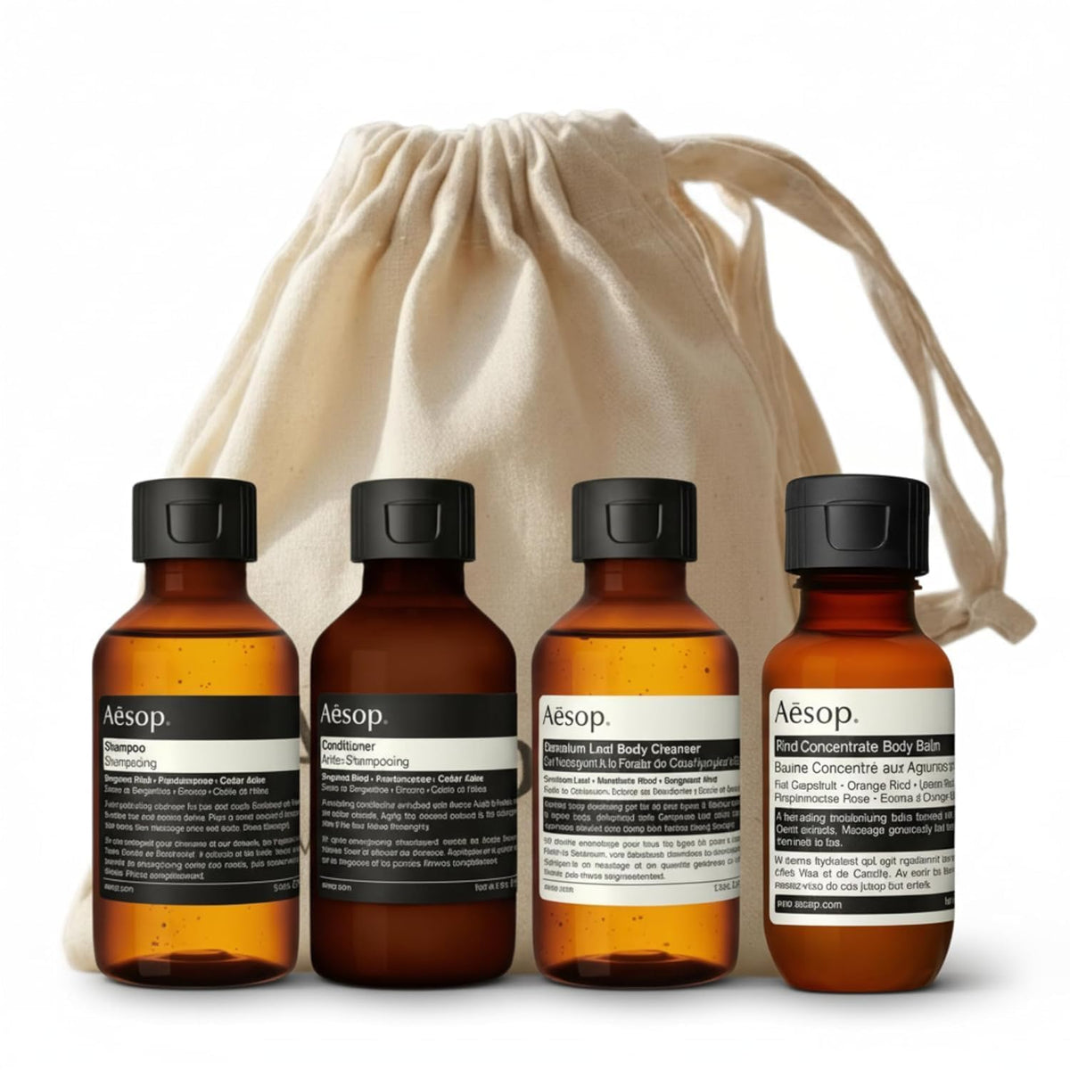 Aesop set vista frontal con cuatro envases y bolsa, práctico para viajar